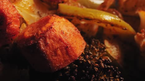 vibrant close-up of grilled veggies - bell peppers, zucchini, carrots - seasoned with herbs and spices