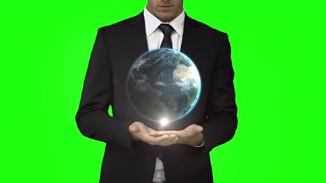 businessman with globe animation in front of green screen