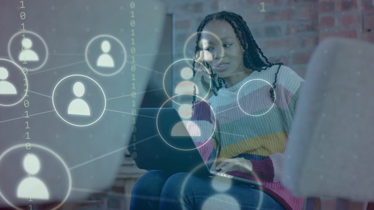 Woman tapping laptop phoning, loading graphic starting network map linking nodes, uniting tech team