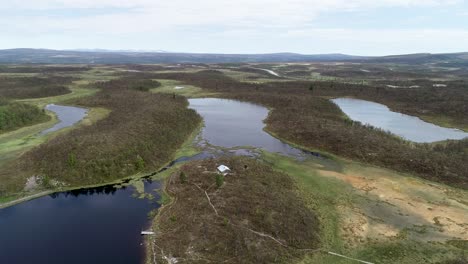 scenic flight over a green forest landscape with lakes and rivers