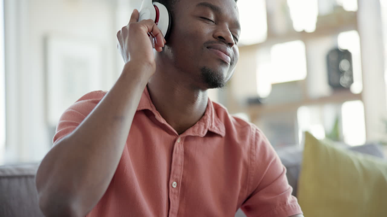 Black man, headphones and listening to music