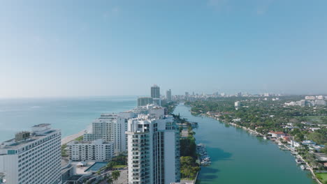Luxury-high-rise-buildings-on-Miami-Beach.-Aerial-view-of-sea-coast-in-town-in-tropical-area.-Miami,-USA