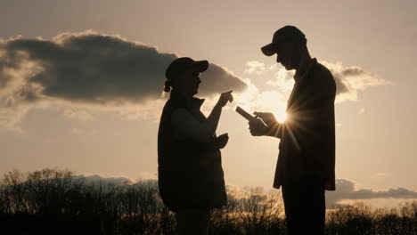 farmers discussing at sunset