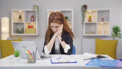 Home-office-worker-woman-nervously-waiting-at-laptop.