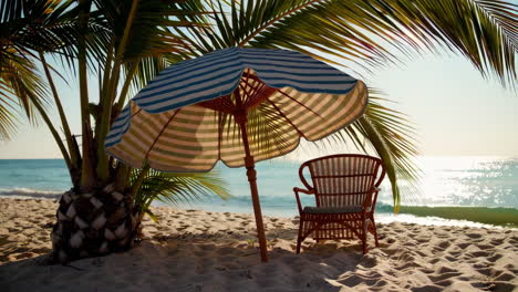 tropical beach with palm tree, umbrella, and chair