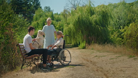 family enjoying a park visit with a dog