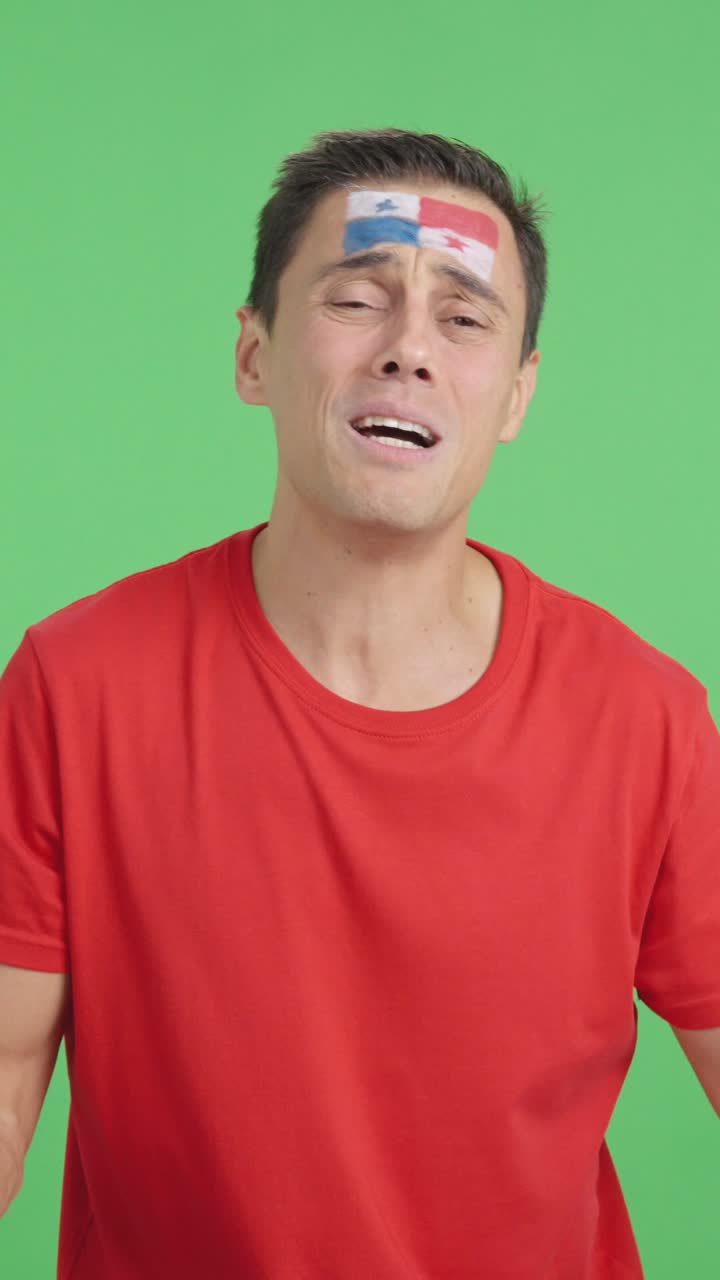 Man cheering for Panama during a match that is lost