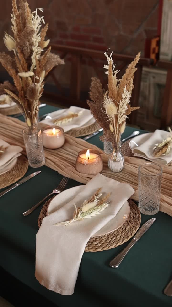 Elegant Table Setting Decorated with Dried Flowers and Candles