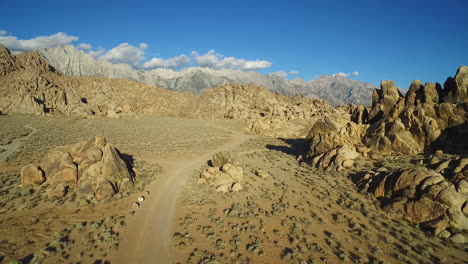 A-high-vista-aérea-sunset-shot-over-the-Alabama-Hills-outside-Lone-Pine-California-with-Mt-Whitney-and-Sierras-background-6