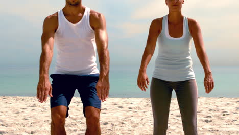 Friends-doing-pilates-on-the-beach