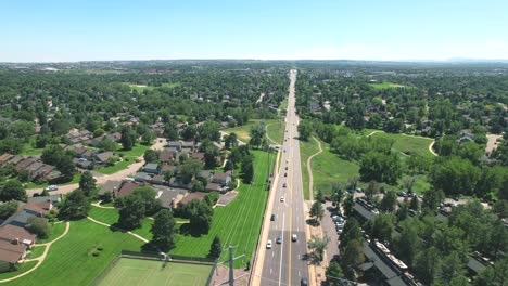 aerial drone video of cars driving through a suburb or neighborhood in denver, colorado, usa