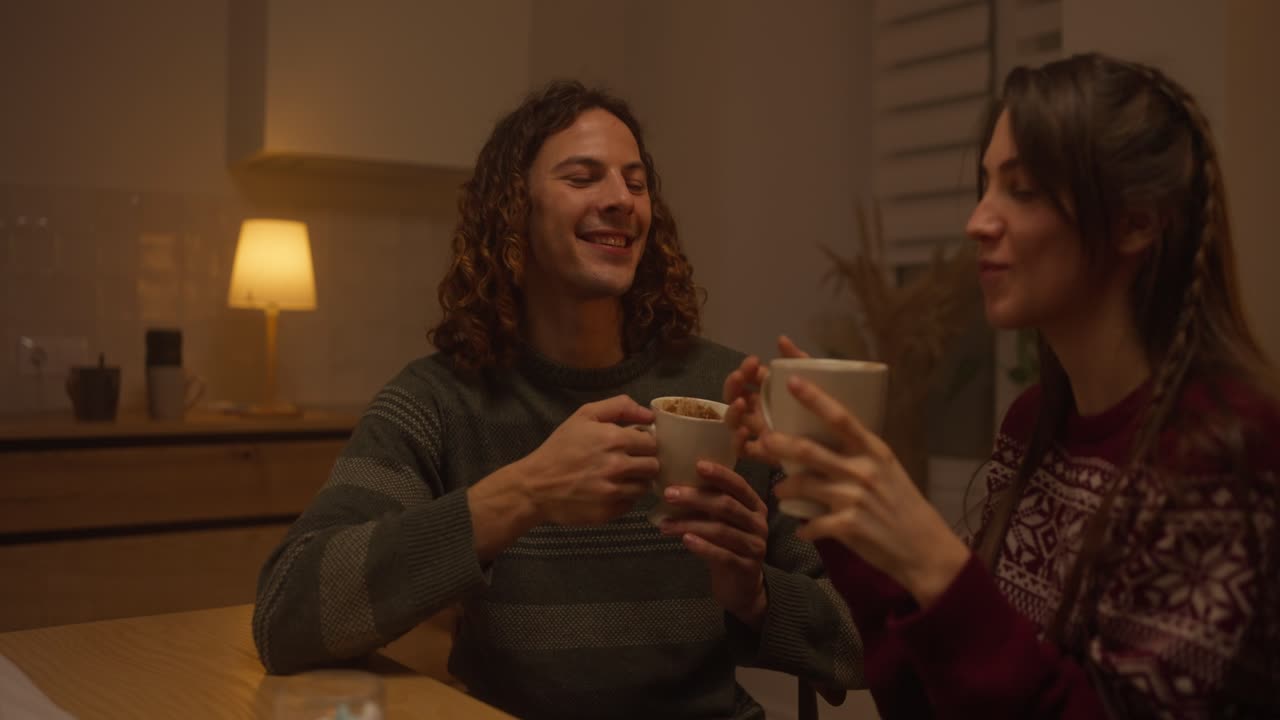 Couple Enjoying Warm Drinks at Home