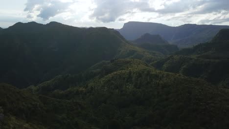 coromandel mountains and valley in shadow with the sub behind clouds