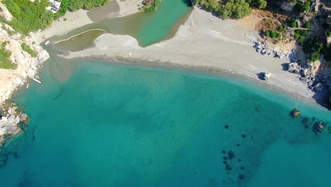 Aerial-of-an-incredible-beach-with-pristine-water-without-people-in-Crete,-Greece