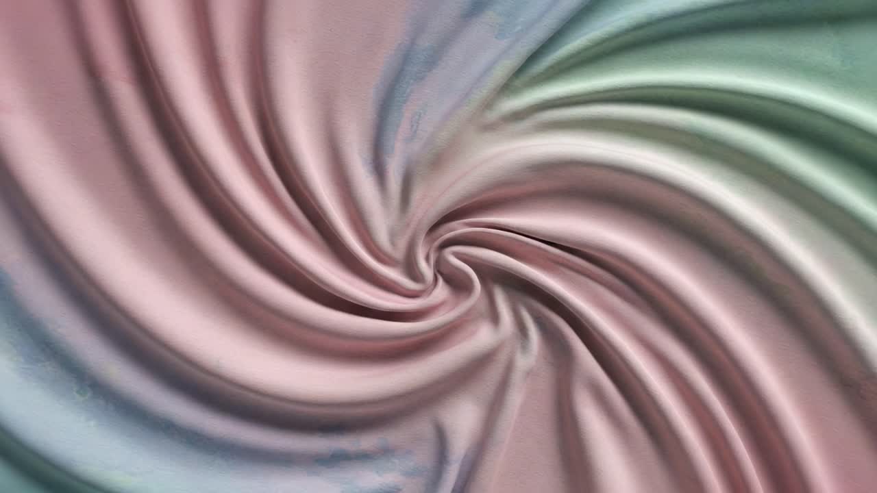 En vakker virvel av mykt stoff: Fengslende mønstre og farger i bevegelse, som fremhever materialets eleganse og tekstur.