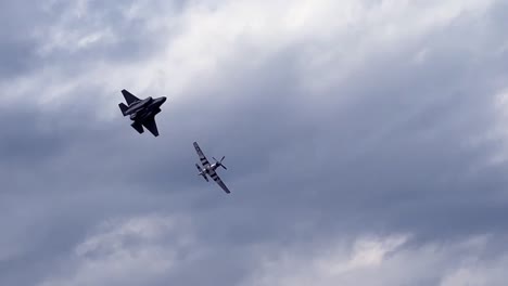 airshow- jet and prop plane fly close in formation- heritage flight