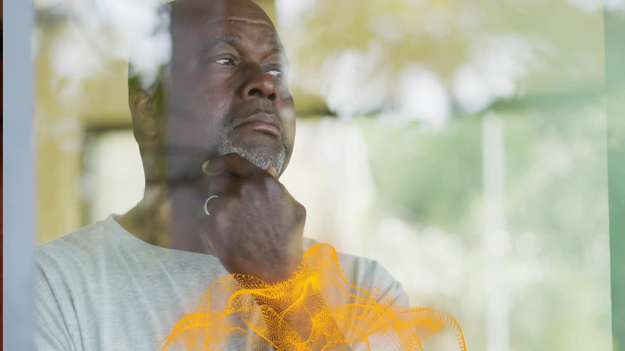 senior man standing facing window causing orange technology mesh forming around torso showing ideas