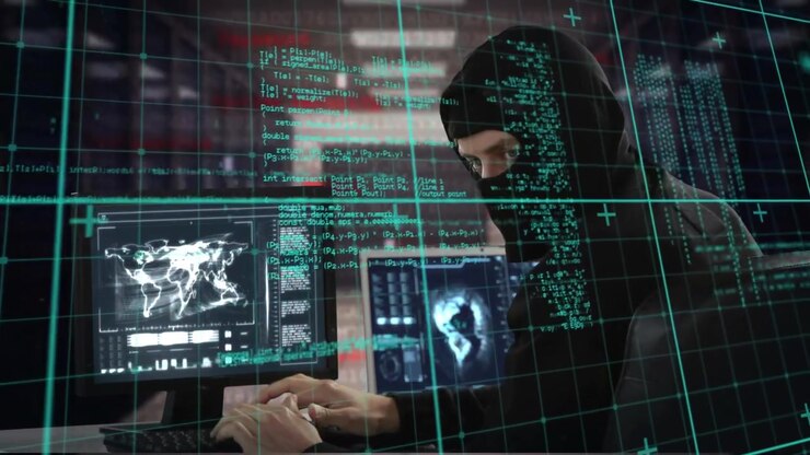 Hacker in Hoodie Typing on Computer with Digital Data Overlay