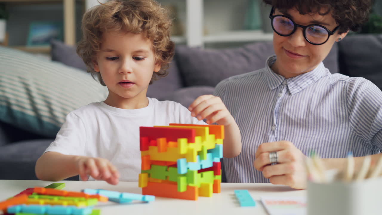 Mother and Child Playing with Colorful Building Blocks