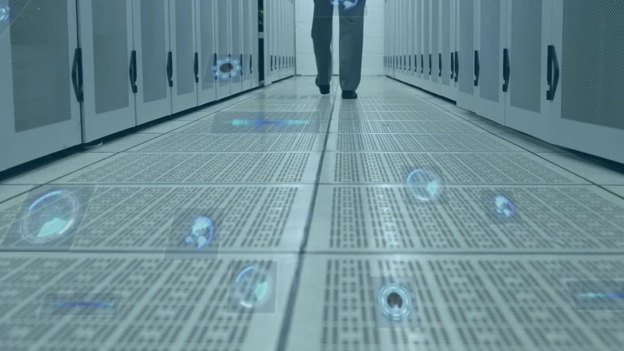 Multiple round scanners against mid section of man walking in computer server room