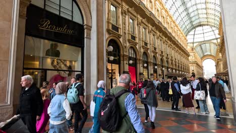 crowds walking through historic shopping arcade