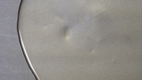 gray metal surface with scratches and dents