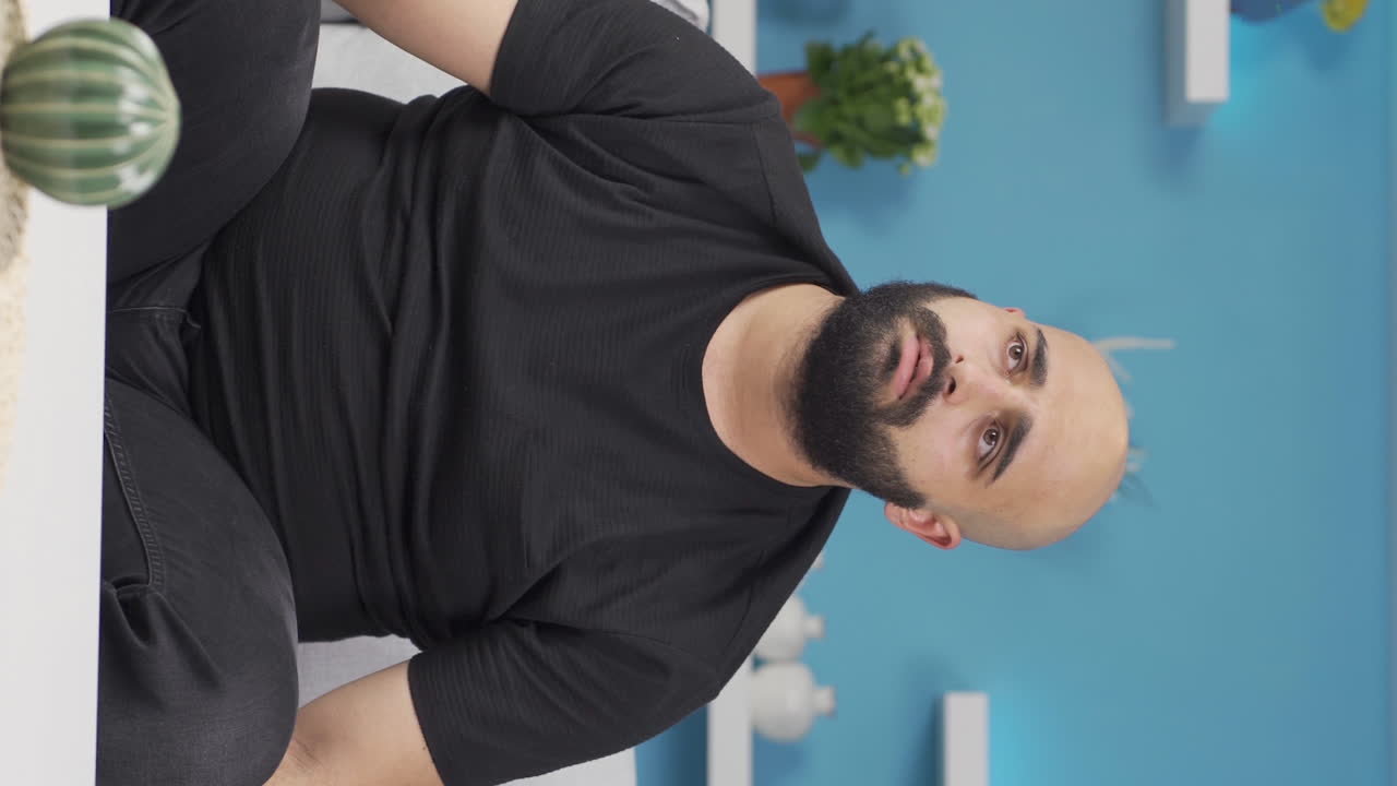 Vertical video of Pensive man.