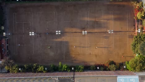 aerial view of tennis courts and parking lot
