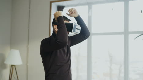 Man wearing VR headset and enjoying virtual experience