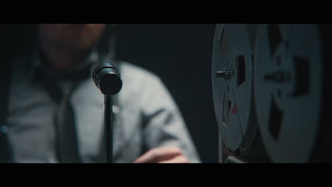 an intelligence officer listens to the wiretap recordings