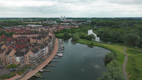 Drone-view-of-Luxury-apartments-beside-a-lake-in-Eastbourne,-England