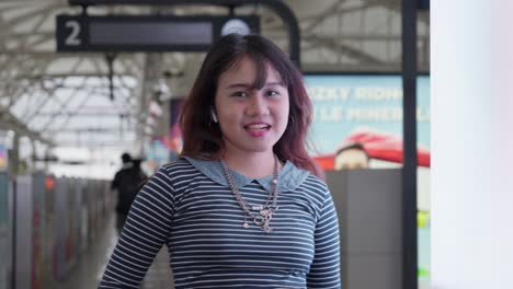indonesian girl posing for the camera with a bright smile