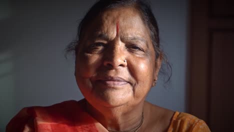 Adult-Indian-Woman-Smiling-And-Staring-At-The-Camera---close-up