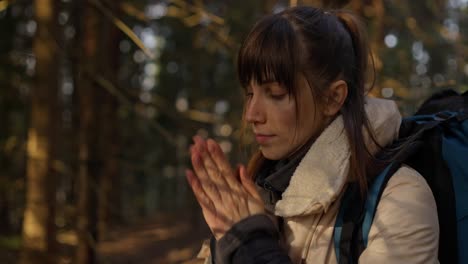 Woman hiking in a cold forest