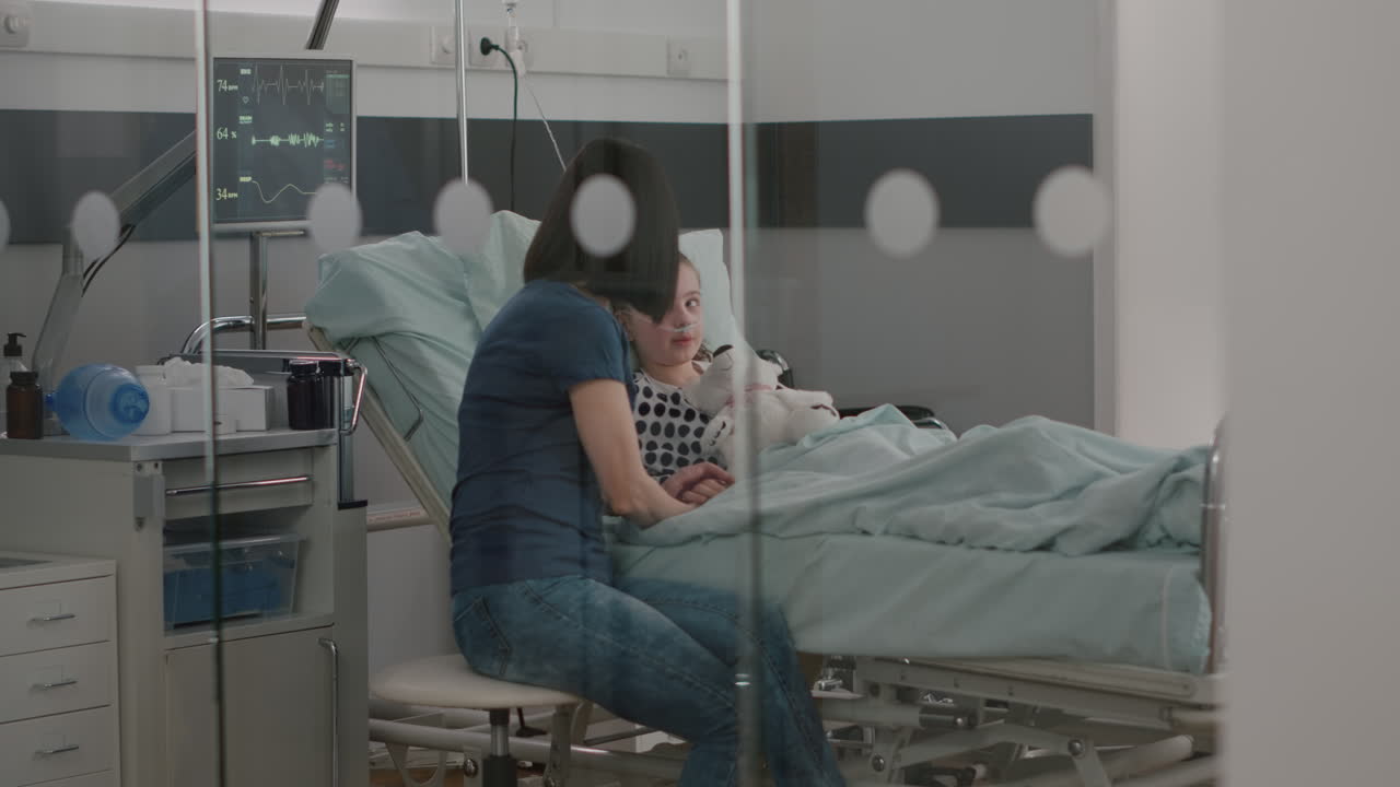 Hospitalized sick child resting in bed after suffering medical surgery during recovery examination