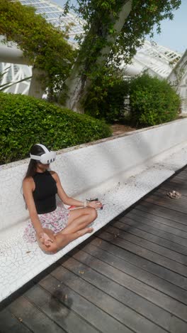 woman meditating in vr headset in a park