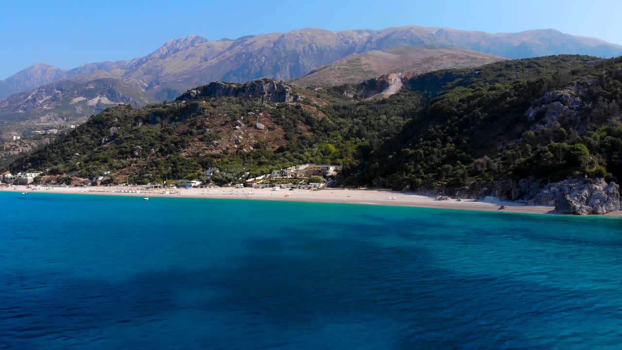 Paradise beach on the bottom of hills and mountains washed by blue azure sea water in Albania
