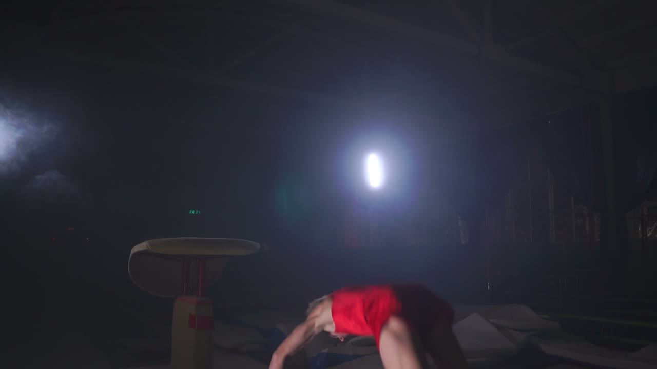 Gymnast gymnastic somersault exercise HD slow-motion video. Athlete salto
