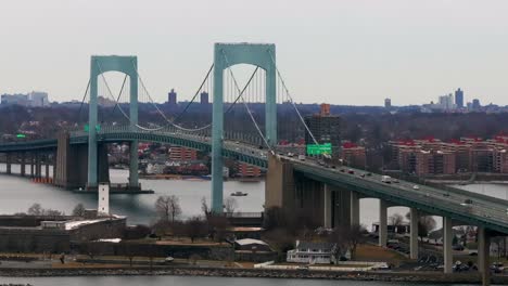 an aerial view of the throgs neck bridge from over the long island sound, ny on a cloudy day