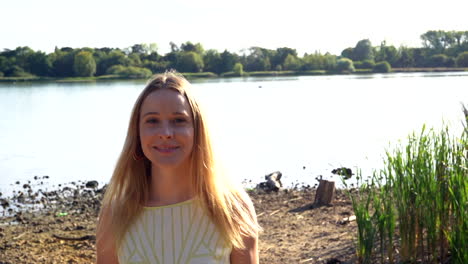 cheerful girl in a park walking and smiling