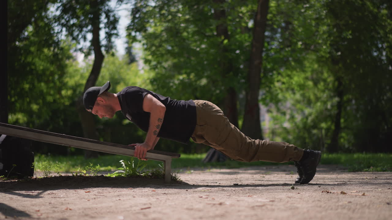Outdoor Strength Training, Calisthenics Exercise In Park, Full Body Plank Emphasizing Chest And Arm Muscles Outdoors, Person Performing Controlled Pushups In Lush Park With Focus On Strength
