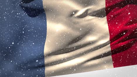 bandera francesa ondeando en la nieve