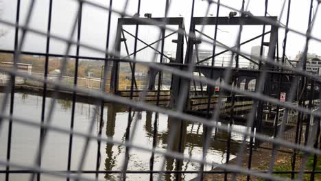 Industrial Victorian Anderton canal lift waterway through gate fence barrier dolly left slow