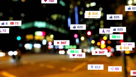 Animation-of-social-media-icons-and-numbers-over-road-traffic-and-cityscape