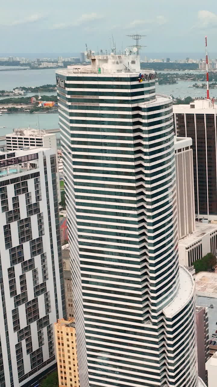Miami, Florida, USA - January 05, 2024: High skyscrapers in the central part of the city. Aerial view. Vertical video