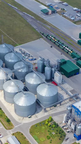 big steel grain elevator warehouse. modern agricultural architecture landscape. vertical video