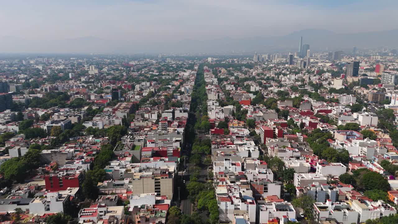 Drone shot of leafy avenues in central Narvarte on a sunny da