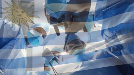 Animation-of-flag-of-uruguay-waving-over-surgeons-in-operating-theatre