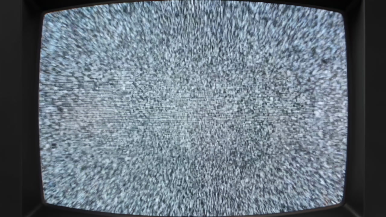 CRT Television Static Fills Black Frame, Grainy Monochrome Snow, Flickering Interference, Faint Hiss,