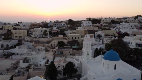 Fly-over-Panagia-ton-Eisodion-Church-at-Sunset,-Megalochori,-Santorini